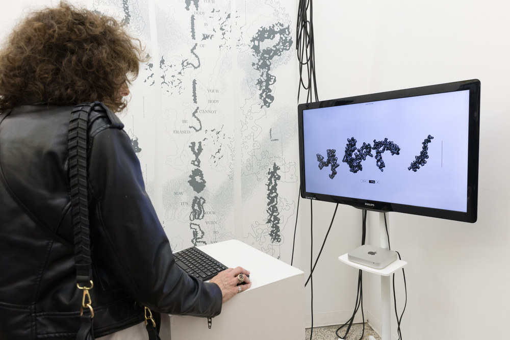 Visitor typing at the installation